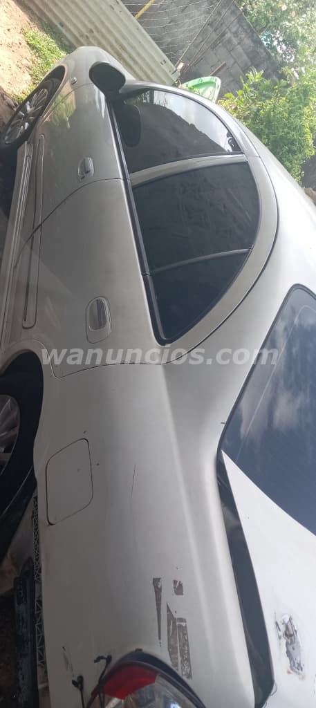 1 US$ - Se vende Nissan Almera 2004, Sedan Blanco (San Francisco, Las Garzas) 2